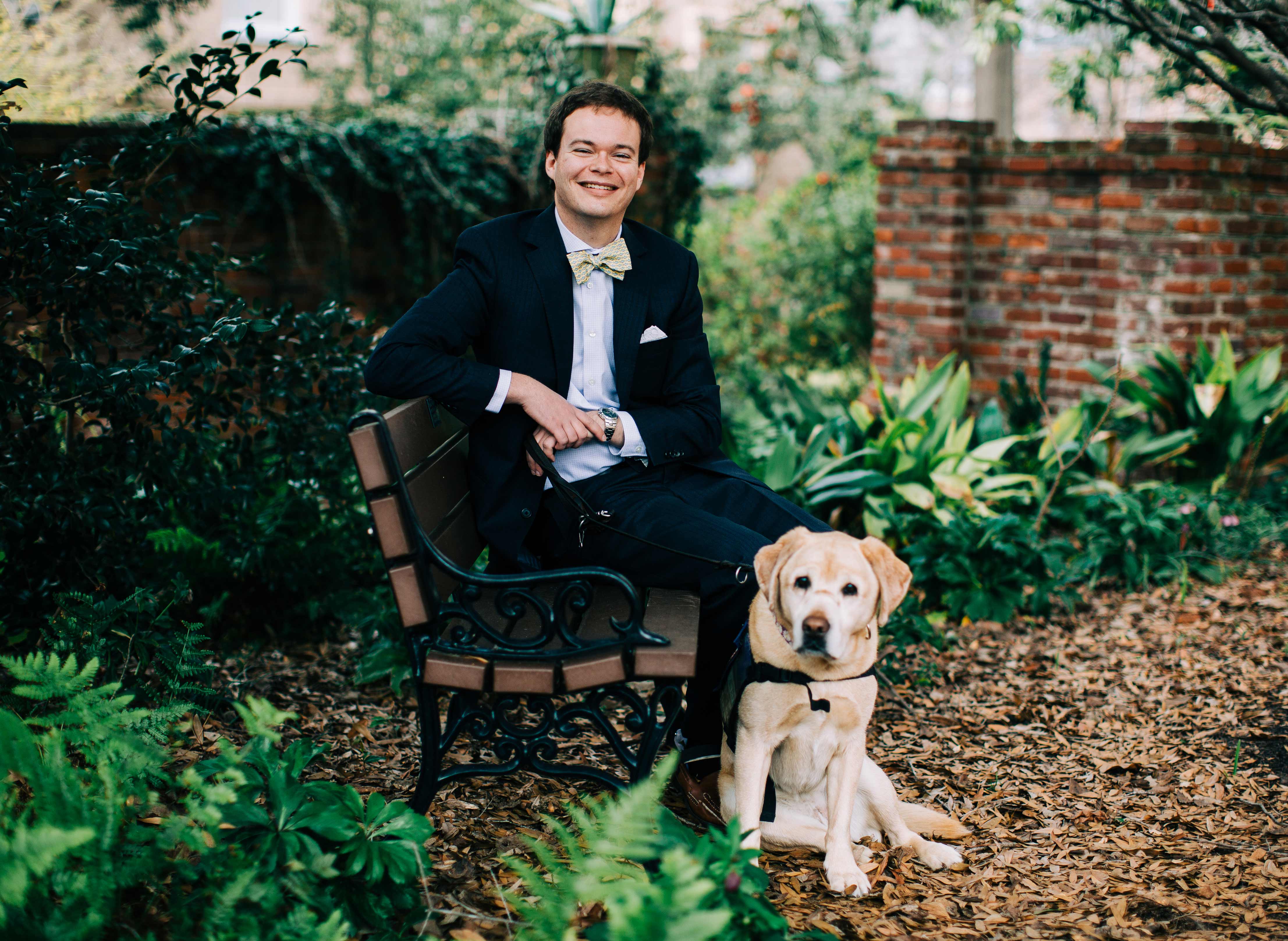 Photo of Jory Fleming with his service dog Daisy